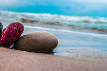 Obraz na płótnie Canvas Zen stones on the beach with sand and sea view