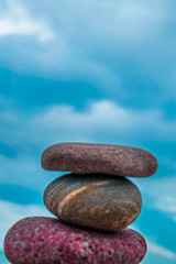 Zen stones on the beach with sand and sea view