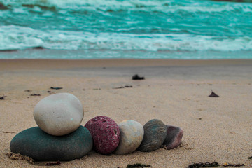 Obraz na płótnie Canvas Zen stones on the beach with sand and sea view
