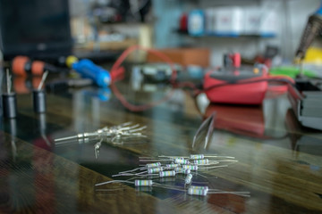 Resistor placed on a glass table  Of electronic technicians and electronic tools placed on the glass table