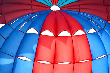 flying Water parachute umbrella on the sky background.