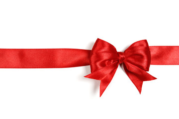 Shiny red satin ribbon on white background