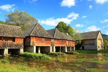 Fototapeta na wymiar Wooden water mills on source of Gacka river in Lika region, Croatia