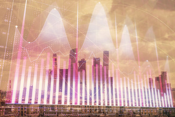 Double exposure of financial graph on downtown veiw background. Concept of stock market research and analysis