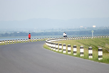 People go to jogging during the evening when the sun is light.