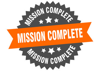 mission complete sign. mission complete orange-black circular band label