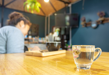  A cup of tea on a wooden table in a coffee shop