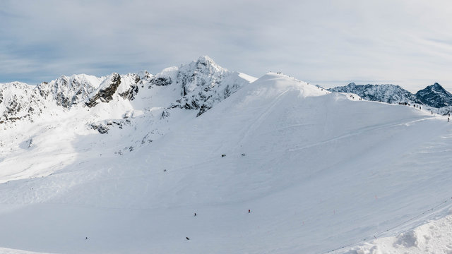 Winter view from Kasprowy Wierch Peak on ski slope and Swinca Peak.