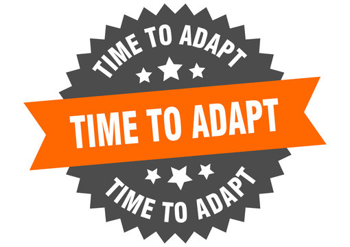 time to adapt sign. time to adapt orange-black circular band label