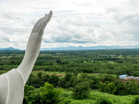 Hand of Buddha statue over the blur background