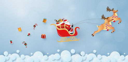 Origami paper art of Santa Claus and reindeer flying on the sky, Merry Christmas and Happy New Year