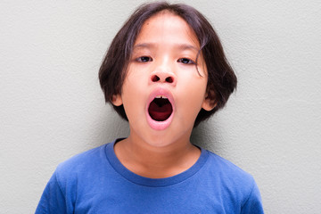 Nine Years Old Thai Girl Yawning
