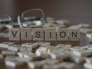 The concept of Vision represented by wooden letter tiles © lexiconimages