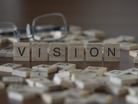 The concept of Vision represented by wooden letter tiles