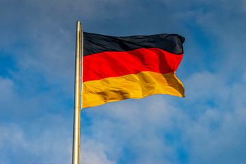 Germany flag black red gold blowing on the flagpole