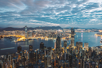 Fototapeta na wymiar Sunrise over Hong Kong from the peak. Hiking up in the dark