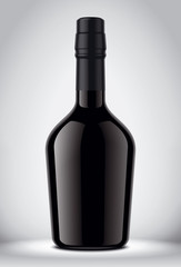 Glass black bottle on gray background