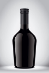 Glass black bottle on gray background