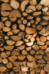 Wall firewood , Background of dry chopped firewood logs in a pile. Harvesting firewood for the winter. Harvesting firewood for the winter.