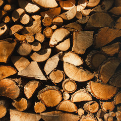 Wall firewood , Background of dry chopped firewood logs in a pile. Harvesting firewood for the...