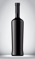 Glass black bottle on gray background