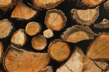 Wall firewood , Background of dry chopped firewood logs in a pile. Harvesting firewood for the...