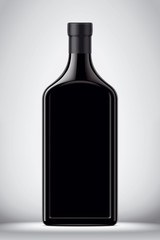 Glass black bottle on gray background