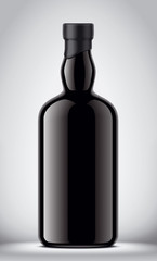Glass black bottle on gray background