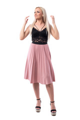 Happy smiling young elegant classy woman explaining and gesticulating with hands. Full body isolated on white background. 