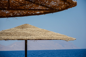 straw umbrella on the beach