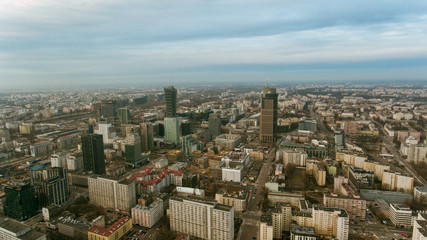 Fototapeta na wymiar Aerial view of the cityscape with skyscrapers and buildings in the business center of Warsaw. Poland. 10. March. 2019. Skyscrapers in the center of the financial district of Warsaw in the daytime.