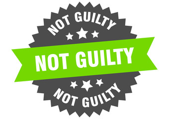 not guilty sign. not guilty green-black circular band label