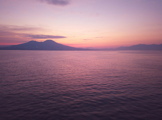 View of Naples city from the sea at summer sunrise