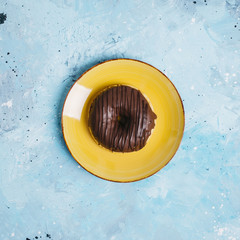 Flat lay of donut on plate