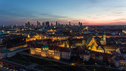 Fototapeta na wymiar Aerial view of the Old city night Warsaw with the square and the royal palace in the night lighting. 