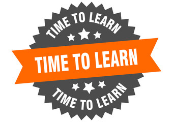 time to learn sign. time to learn orange-black circular band label