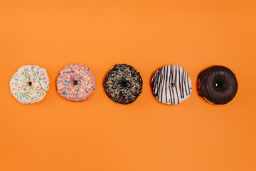 Flat lay composition of tasty donuts