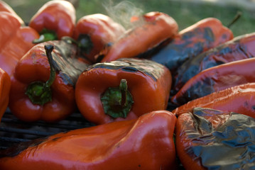Roasting fresh red paprika on grill