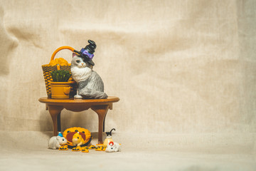 halloween holiday decoration concept, A lot of halloween party object miniature toys decoration on wrinkled calico background.