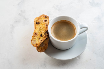 Christmas homemade cookies biscotti with dry berries and cup of coffee. Copy space.