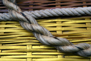 Strips of wood held together by an old rope