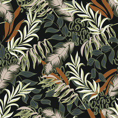 Original seamless tropical pattern with bright colorful leaves and plants on a dark background.  Modern abstract design for fabric, paper, interior decor. Seamless exotic pattern with tropical plants.