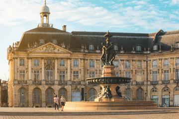 Fototapeta na wymiar Three Graces fountain in Place de la Bourse. This square is one of the most representative works of classical French architecture.