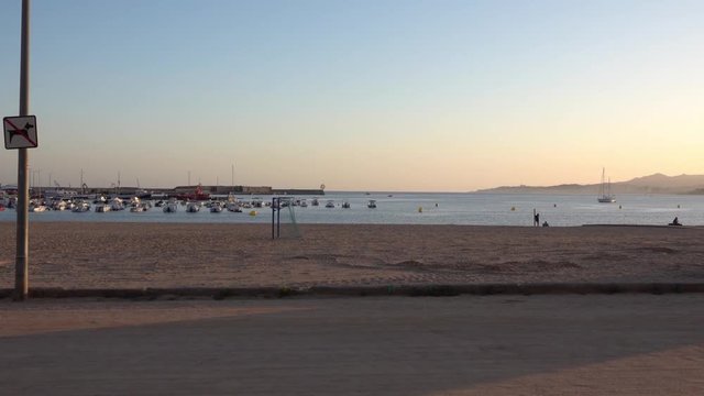 Marina in the sea with boat in the ries of sun in sunset