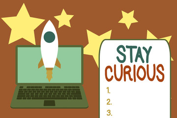 Word writing text Stay Curious. Business photo showcasing attention through being inexplicable or highly unusual Launching rocket up laptop . Startup project. Developing goal objectives