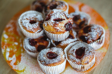 Delicious homemade cake with cherries, arranged on the plate.