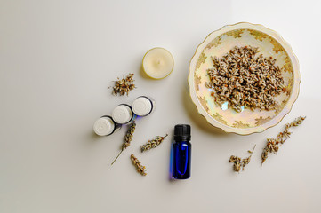 Dried Lavender seeds and Lavender aromatherapy essential oils with candle