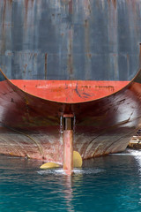 Cargo Ship . Isolated. Close-up of  ships stern moored in Shipyard.