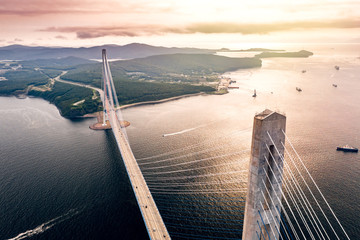 Aerial view of the Russky Bridge connecting Vladivostok city with the Russky Island over the Strait of Eastern Bosphorus. Cable-stayed road bridge over the sea in Primorsky Krai, Far East, Russia