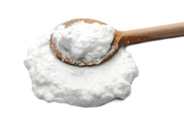 Yogurt in wooden spoon isolated on white background